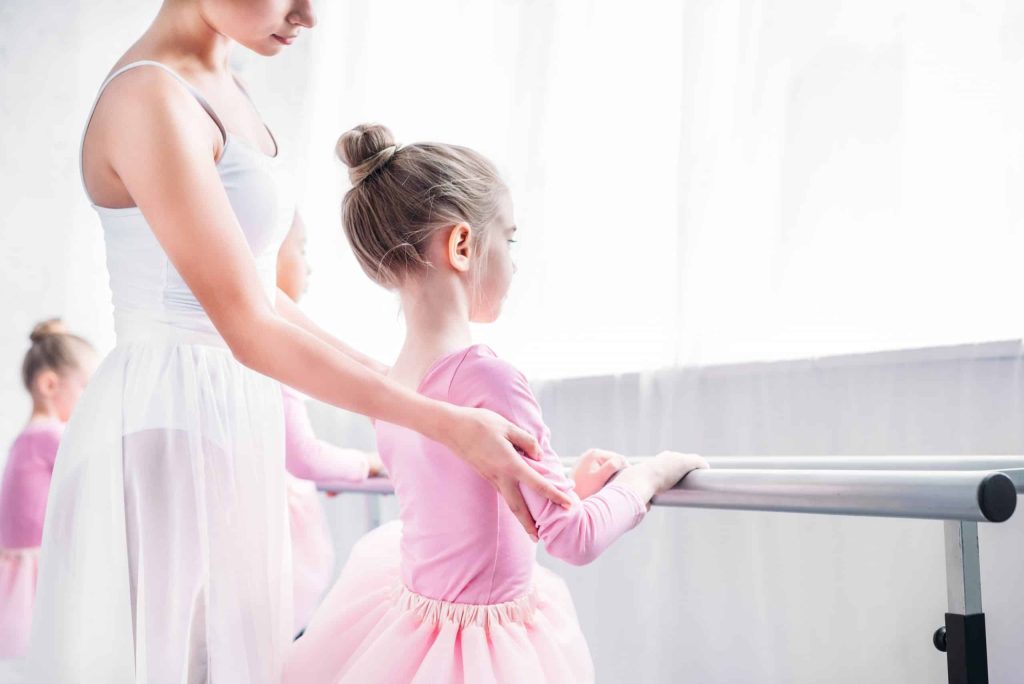 cropped shot of ballet teacher exercising with kid QZF89A9 scaled 1