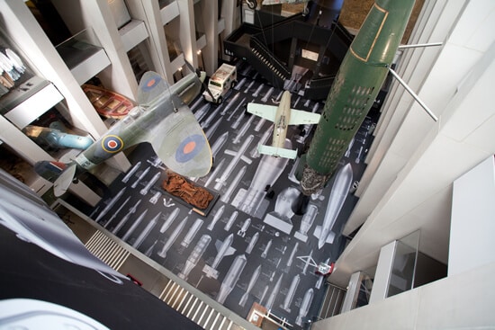 Top view of the IWM London's atrium, where Ai Weiwei's "History of Bombs" is on display using printed Harlequin Clarity vinyl floor