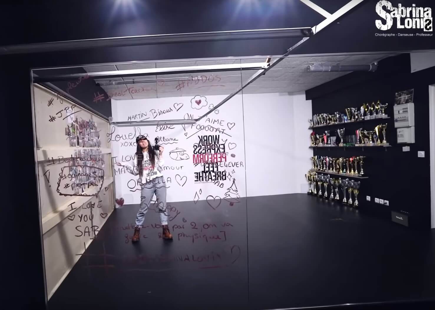 Sabrina shows off her finished studio with messages from wellwishing students